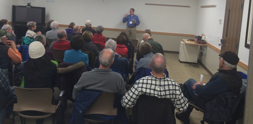 Dan Slanina of Federal Highways in Seattle explains the Warren Wagon Road repaving project to a packed room at the Payette National Forest 